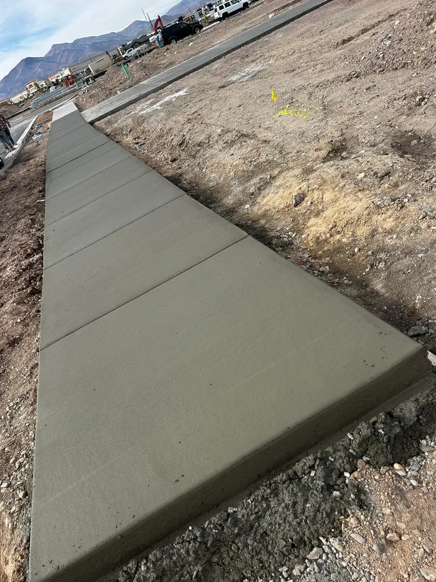 Fresh concrete walkway with straight edges and evenly spaced joints