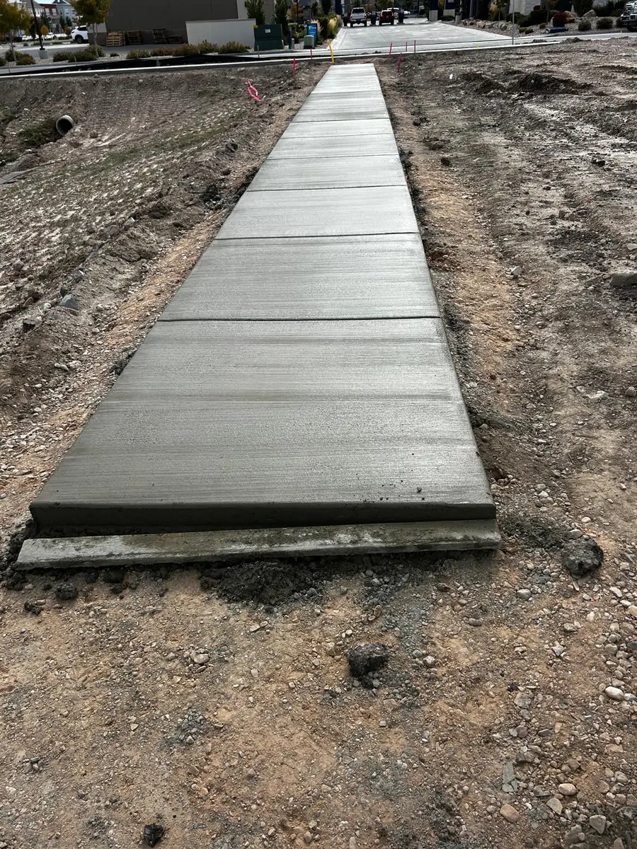 Broom-finished concrete walkway with straight control joints