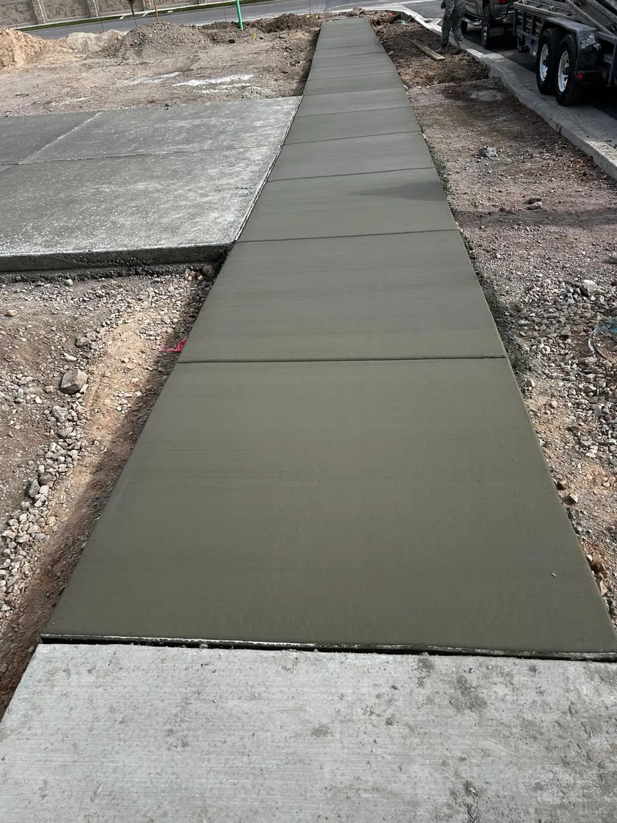 Concrete walkway joining an existing slab