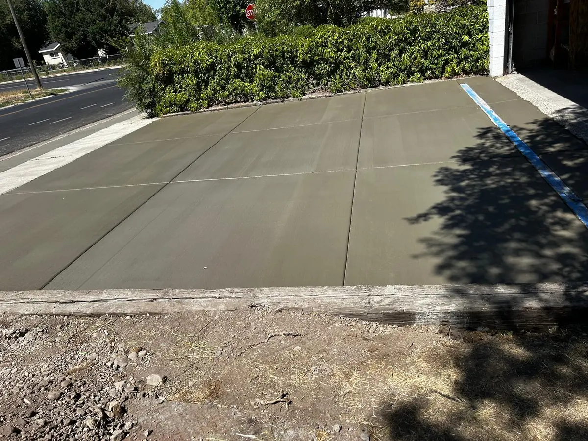 Wide concrete driveway with newly finished panel joints