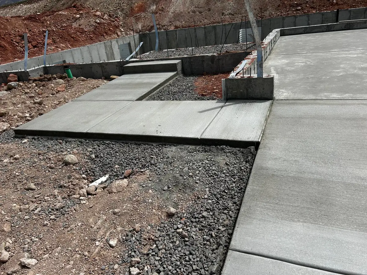 Connected concrete slabs and foundations on a construction site