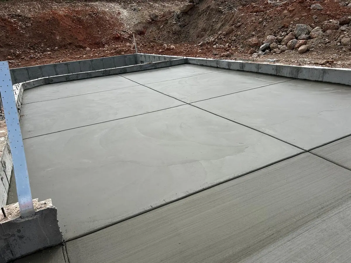 Concrete slab showing broom texture and straight control joints