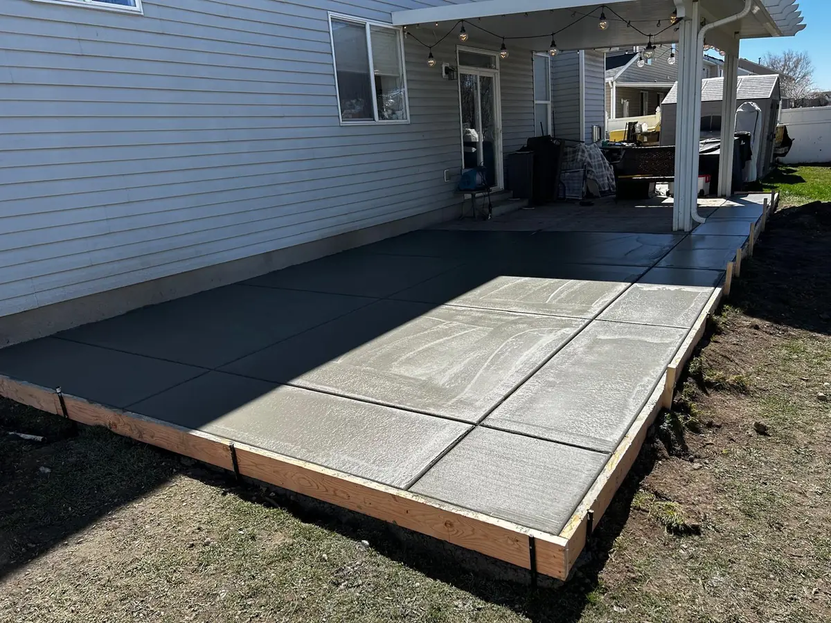 Concrete outdoor living surface with a broom finish