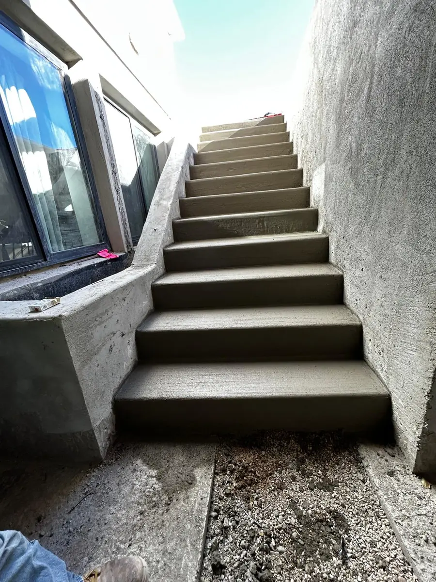 Concrete stairs leading up from a basement entrance